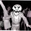 Placeholder: 1980s photo of new year's party alien with dancing happy