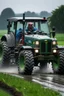 Placeholder: A farmer car driving a tractor in the rain.