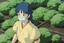 Placeholder: A young woman, Yui, is seen inside one of the biodomes tending to a variety of plant life. Her eyes reflect determination and spirit. She wears a respirator around her neck, a symbol of the harsh outside world and her chronic lung condition.