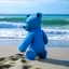 Placeholder: a blue bear is going the beach to swim