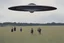 Placeholder: bumper sticker design, westall in bold heading text, ufo 1966, lots of school children looking up in a field, mysterious cool, bold