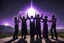 Placeholder: Subject & Action: A high-resolution, photorealistic cosmic ceremony on the edge of the void! This is a wide-angle photograph capturing a gathering of five modern beatnik wanderers worshipping the total solar eclipse. Their arms are outstretched in ecstasy, their faces turned upward, dissolving into the light. One figure, centrally positioned, has a halo of purple and blue cosmic light swirling around their head. Environment & Setting: We are on the rugged Landes coast, beach of La Piste. The sa