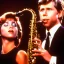 Placeholder: ClosedREd-haired Ron howard Is richie from happy days playing his saxophone with his "eyes closed", rock band, embouchure, joanie cunningham