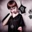 Placeholder: Realistic photo Russian shorthair tomboy with black magic evil forces amulet on the neck boyish face men's look boys face boylike in lacy girlish nightgown in girlish room with amulets of black magic and symbols of evil forces on the wall