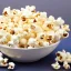 Placeholder: A bowl of popcorn with individual popped popcorn having the faces of Barack Obama and Nancy Pelosi