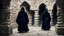 Placeholder: black robe hooded monks in the stone castle