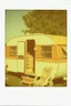 Placeholder: Vintage polaroid of a gitano caravan,orange