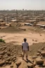 Placeholder: Sudan, destroyed city, airstrikes, one man in the distance