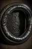 Placeholder: ouroboros made of black ink, leather background covering the whole image