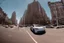Placeholder: A Tesla 'Model S' is racing at top speed, near the Flatiron Building in Manhattan. (CINEMATIC, WIDE ANGLE LENS, PHOTO REAL)