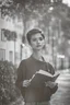 Placeholder: a student girl 22 years old ,short hair with her books in her hand walking in street,next to trees.