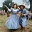 Placeholder: [high res photo by Jill Freedman] Dorothy Gale in her blue Gingham dress attacks the Scarecrow with a zippo lighter, a flying saucer in the background