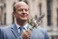 Placeholder: chancellor Olaf Scholz next to a dove, holding an olive branch