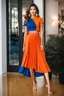 Placeholder: fullbody shot of young-beautiful-ozbek-with-a-perfect-face-with-make-up-wearing-orange top and midi pleated blue skirt