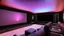 Placeholder: Generate an image of a sleek home cinema with our top-notch projectors and surround sound systems with a star-lined ceiling similar to a Rolls Royce in a high-rise penthouse