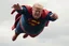 Placeholder: a thoroughly confused, frail, elderly and obese donald trump flying through the air dressed as superman