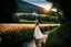 Placeholder: wide angle shot of golden wheat field next to river ,a watermill on river, a beautiful girl in pretty long dress walking in