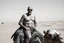 Placeholder: man looking like Walter White in breaking bad, bald, with bare chest riding on a camel in sahara in desert, panorama, black and white photo