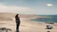 Placeholder: A woman in a catsuit standing on a beach of a rocky landscape with a crashed spaceship in the distance