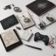 Placeholder: joypad, compass, books on the white table