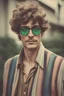 Placeholder: man with Parisian bohemian look and glasses of colours and poor hair on the head. Farsightedness glasses and big eyes. Vintage look and feel like photos of the 70s