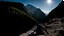 Placeholder: photo from a man falls down frokm a mountain with a backpack, he falls from a high cliff into the abyss, detalied, Professional photography, natural lighting, canon lens, shot on dslr 64 megapixels ,sharp focus