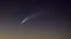 Placeholder: Comet in the night sky over the plain