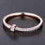 Placeholder: delicate thin ring with baguette diamond, knot, rose gold, thin ring