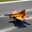 Placeholder: award winning photograph of a house-fly fighter-jet genetic-splice designed by only one vehicle per image painted metallic orange traveling at a high rate of speed, jet intake off of front center of vehicle and jet exhaust out the rear with bright blue flames painted on the hood and front quarter panels, bilaterally symetrical, more a high speed road vehicle