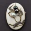 Placeholder: postcard of kingfisher ivory brooch with black pearl inlay, opalescent marble carving, decorative design, classical ornament, highly ornate, highly intricate, highly detailed etching, marble carving, warm lighting, linen backdrop