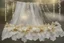 Placeholder: double exposure, garter flowers strung on wire with pearls and gems, heart and love, double exposure, merged layers, silver and gold tin foil, waterfall, in sunshine on a lace blanket