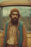 Placeholder: Hippie bohemian young man with Parisian bohemian look and glasses of colours and poor and short short short and poor hair on the head with receding hairline. Farsightedness glasses with big eyes. Long beard. Vintage look and feel like photo styleof the 70s