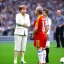 Placeholder: Angela Merkel in a referee jersey officiating for a soccer match at Wembley Stadium