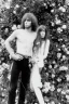 Placeholder: Jim Morrison and Pamela Courson ,music, NSFW, watermark, bohemian style , blurry,beautiful,elegant,roses, fantasy by anni dittman