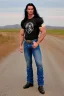 Placeholder: A very muscular man with long black hair, blue eyes, wearing a cowboy shirt and blue jeans