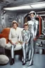 Placeholder: 1950s traditional Christian family in space station family room but mom is a futuristic female silver android in a latex silver android suit. Only mom is an android. Mom has a normal human face, with silver sci-fi makeup. Mom is robotically cleaning up, while the rest are sitting watching tv