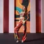 Placeholder: picture of lady with a top and cifi pants stye design posing in a modern art stage