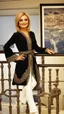 Placeholder: Googoosh persian singer smile and standing pose in luxury hotel labi