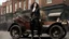 Placeholder: full-height portrait of a woman with straight shoulder-length black hair, with metal arms and legs, dressed in leather trousers, and a waistcoat, in a busy Victorian street next to a steampunk car