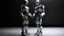 Placeholder: Create an image featuring two humanoid robots holding hands. One robot should have a shiny light gray finish, while the other should have an opaque dark gray appearance. Both robots have their heads slightly tilted downwards, giving a mechanical and somewhat contemplative look. The setting is minimalistic, focusing on the contrast between the robots' finishes and their human-like connection. Contemporary art.