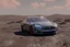 Placeholder: A Tesla 'Model Y' is drifting at high speeds, at the lunar landing site of the 'Apollo 11'. (CINEMATIC, WIDE ANGLE LENS, PHOTO REAL)