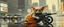 Placeholder: master oil painting by Rembrandt, the tilted quilter,glasses and ticks, cyberpunk imagery synchronized stylized fluffy gremlin with wolf rat aura laying low holding a few guns barely hanging on, drumming kit flat power trike flickering stable core, wet reflective salt flat city, fast motion blur background, translucent tube cars, technocracy mega tv