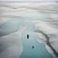 Placeholder: A captivating hyper minimalist photograph from a helicopter looking down on a large barren ice-covered lake, in the distance is a man sitting in a chair ice fishing. The overall color palette is muted, the flat treeless landscape stretches out in a long shot, creating a sense of isolation and desolation