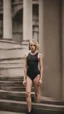 Placeholder: beautiful anorexic woman, total shot, short shiny black triathlon swimsuit, short blond wavy bob hair, blurred concrete background