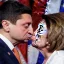 Placeholder: NANCY PELOSI, KISSING Volodymyr Zelensky WITH A BEARD wearing TANKTOP,