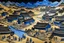 Placeholder: A black village in a shadow realm designed in ancient Egyptian architectures and sculptures painted by Katsushika Hokusai