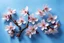 Placeholder: fantastic light pin blue background with four bunches of cherry blossoms