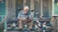 Placeholder: confused older man using cellphone on his porch surrounded by many ducks