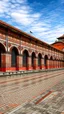 Placeholder: An orangish red industrial train station designed in ancient Roman mosaics painted by Henry Robert-Bresil