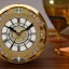 Placeholder: crystal ornate round clock with a transparent body, wood and black and gold, transparent, rococo, Artstation, intricate detailed 8 k, ornate and jewels,